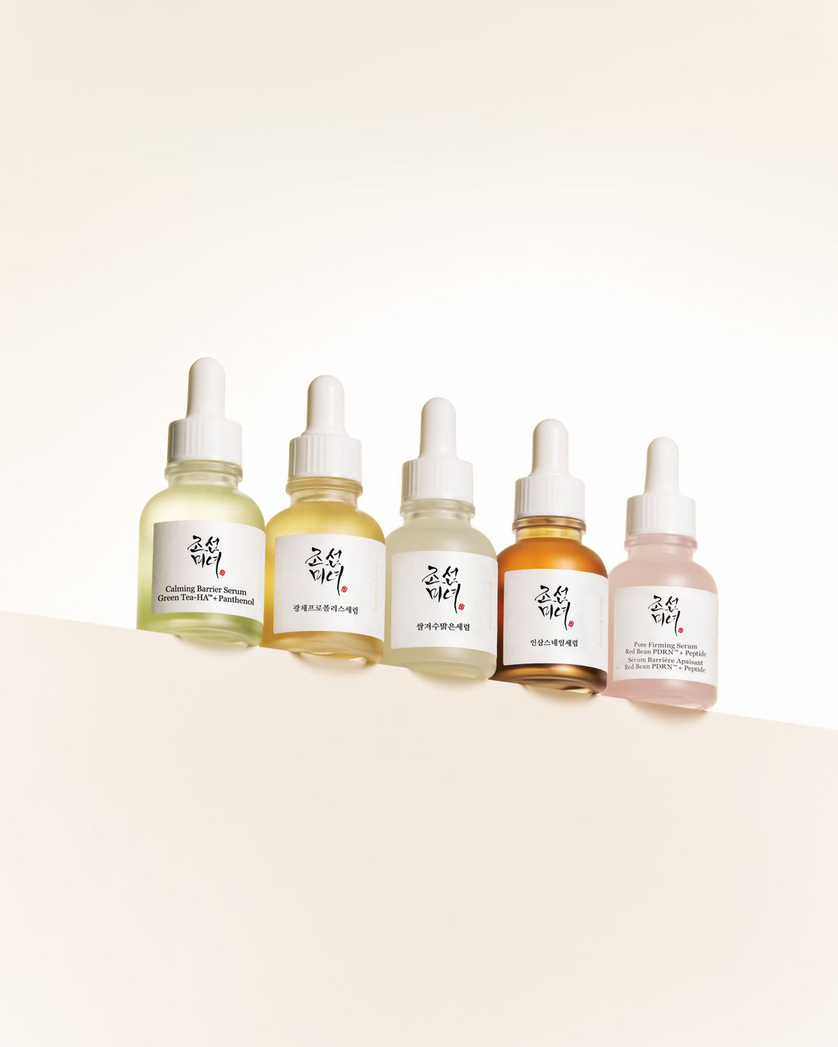 a group of bottles with white caps