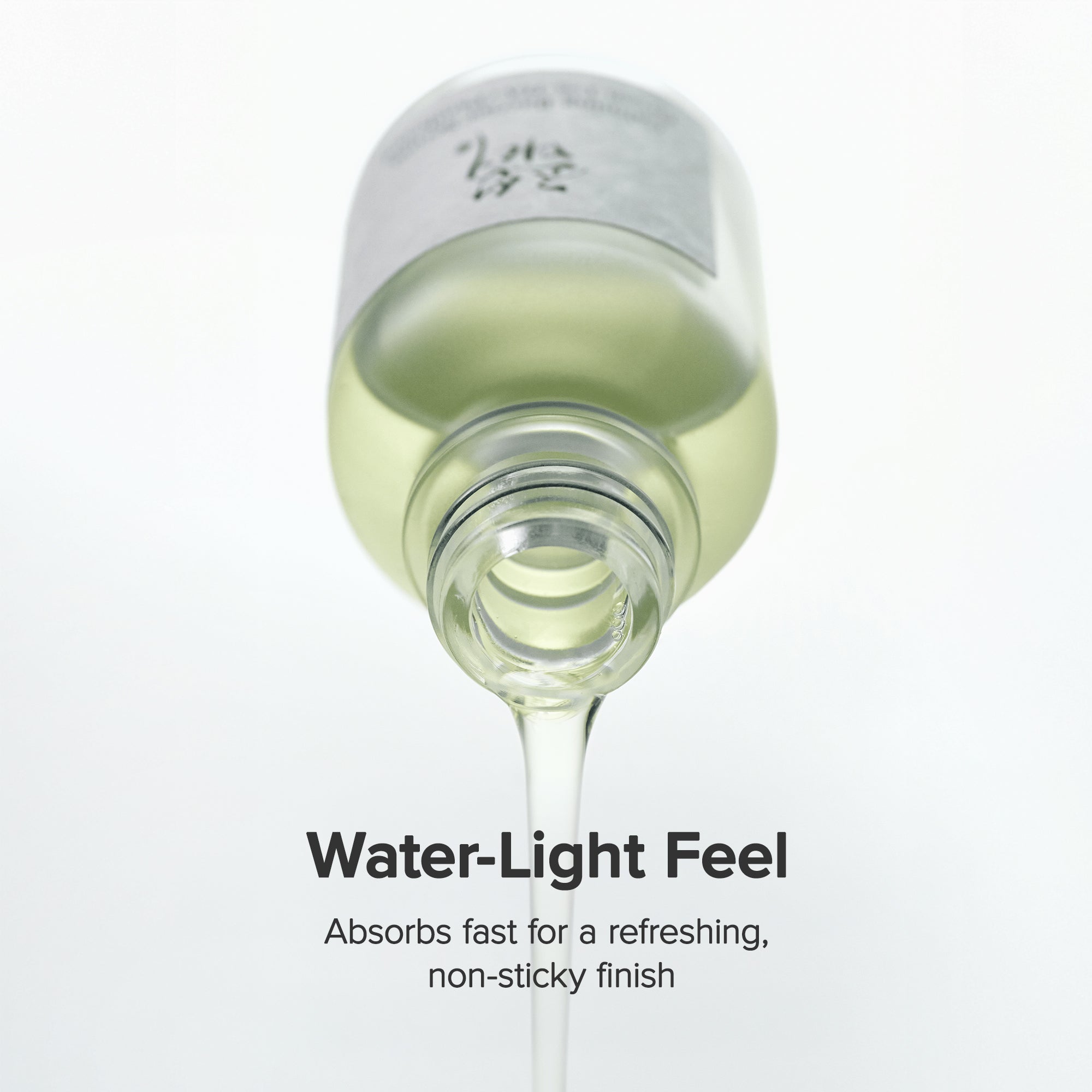 a bottle of liquid dripping from a drop of liquid