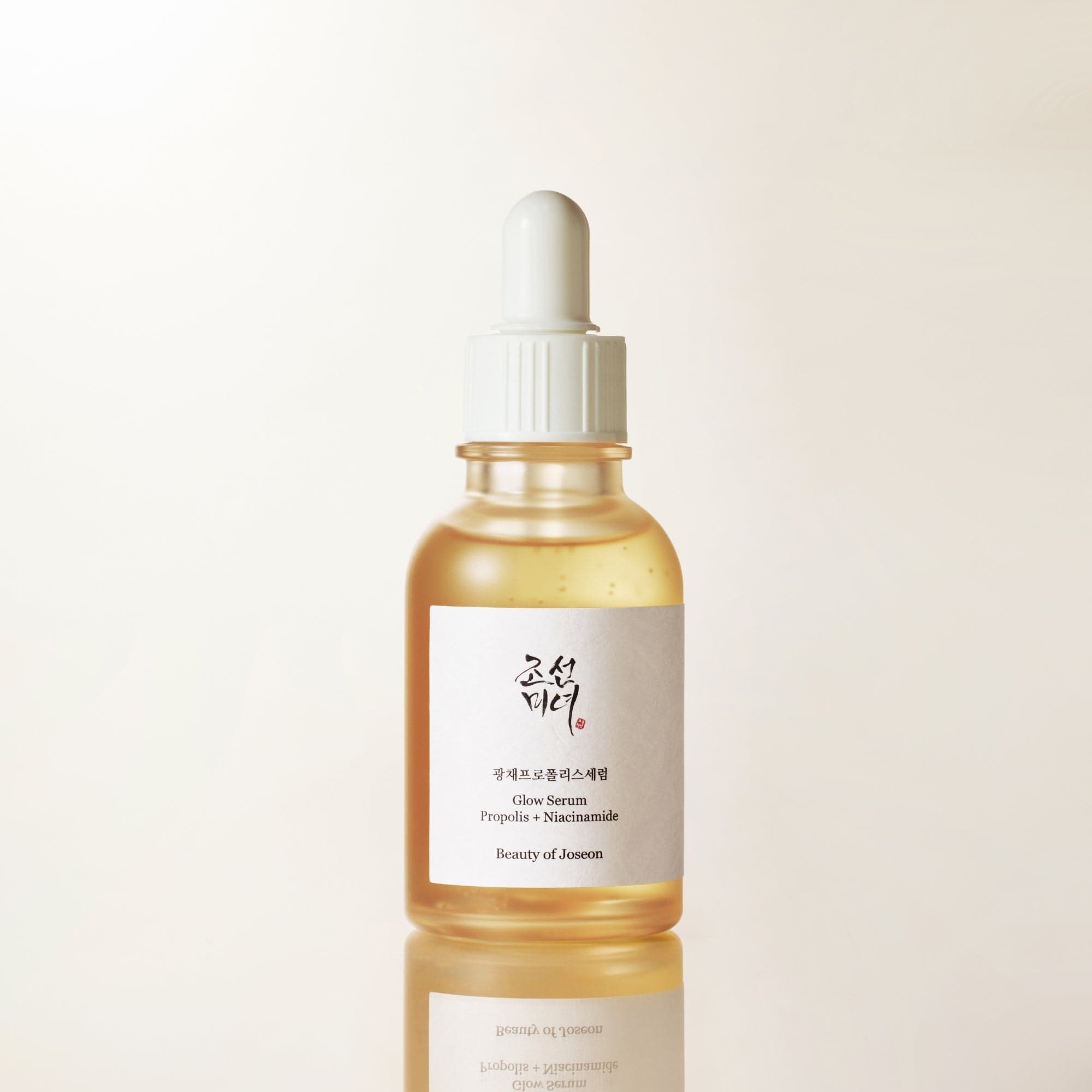 a bottle of liquid with a dropper