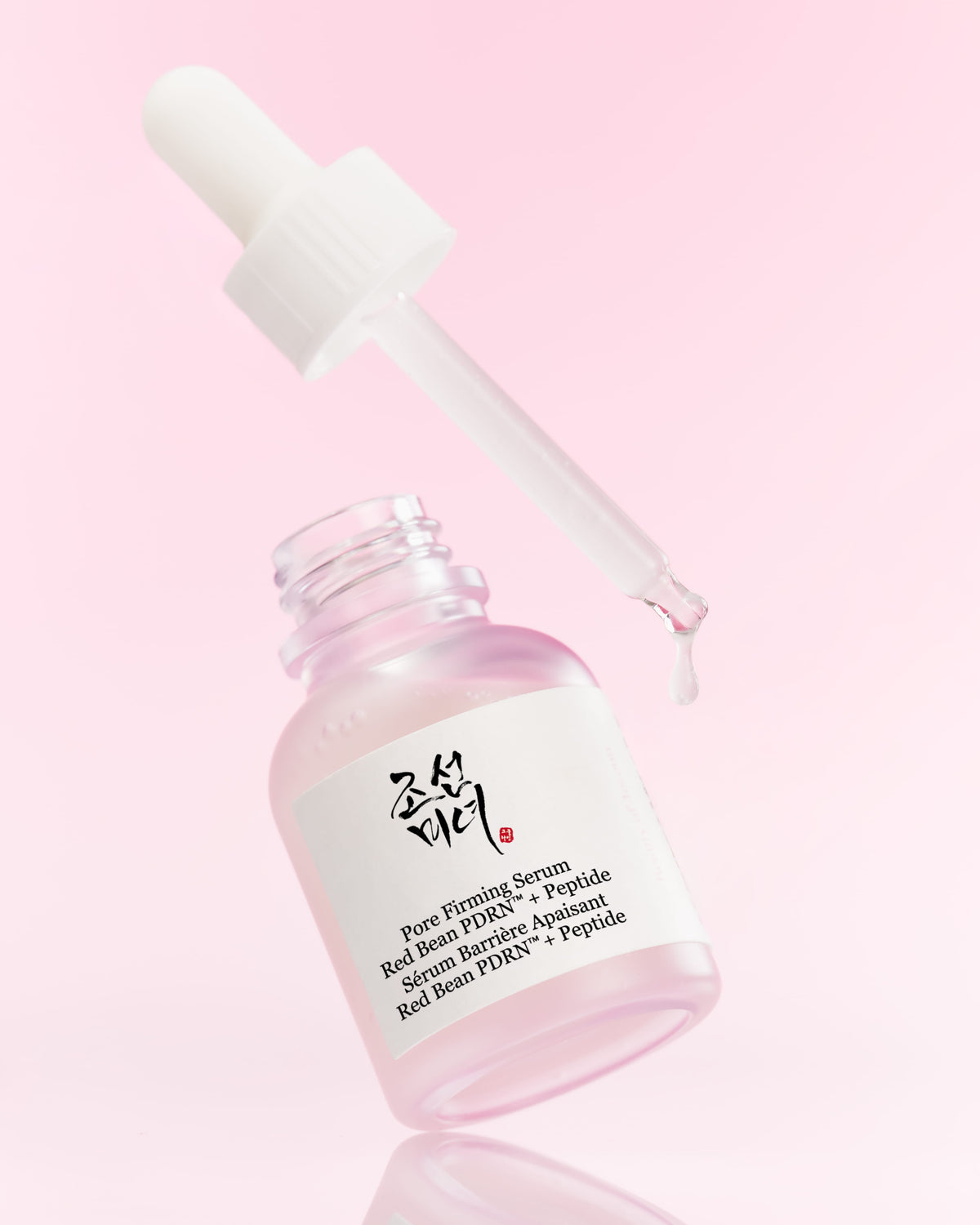 a dropper over a bottle